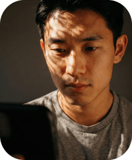 male user looking at phone screen